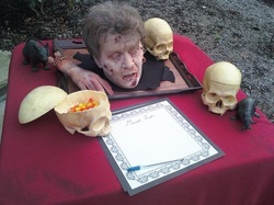 a Living head for Halloween, or zombie, performed by MArk clark of Aardvark Entertainment